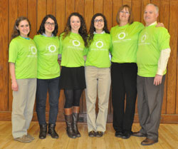 Colleen and Mark Lahr, at right, pose in February at the Archbishop Edward T. O’Meara Catholic Center in Indianapolis with four young women who were awarded scholarships to go on foreign mission trips. The awardees are, from left, Rebecca Doyle, Mary Carper, Shannon Jager and Nicolette Peters. They received the scholarships from the Brooke Nicole Lahr Memorial Fund for International Mission Work. It is named after Mark and Colleen’s daughter, who died in Mexico in 2013 while doing mission work. (Photo by Sean Gallagher)