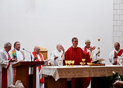 Lafayette Bishop Timothy L. Doherty, center, was the principal celebrant and homilist at the opening Mass of the 50th anniversary celebration of the Central Indiana Cursillo Community on Aug. 9 at St. Susanna Church in Plainfield. Pictured at the altar, from left, are Deacon Frank Roberts, Father Glenn O’Connor, Father Paul Graf, Father Marty Peter, Bishop Doherty, Father Keith Hosey and Deacon Michael Gray. (Photos by Patty Lamb)