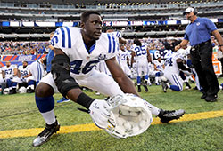 Indianapolis Colts linebacker Daniel Adongo stretches before a preseason game on Aug. 18, 2013, at MetLife Stadium in East Rutherford, N.J. (Photo courtesy of the Indianapolis Colts)