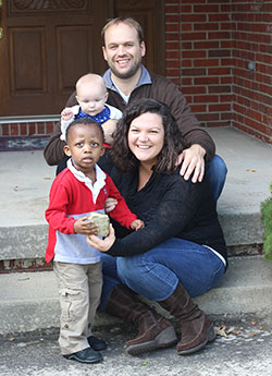 Ed and Jane Seib, members of St. Thomas Aquinas Parish in Indianapolis, pose with their children, 2-year-old Eddie and 8-month-old Daisy, in this Oct. 4 photo. The Seibs adopted Eddie through St. Elizabeth/Coleman Adoption and Pregnancy Services in Indianapolis. The organization is associated with Catholic Charities and benefits from the annual United Catholic Appeal: Christ Our Hope funds. (Submitted photo by Susie Blackmore Photography)