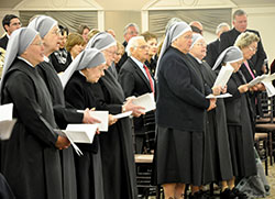 Seven of the nine Little Sisters of the Poor who operate the St. Augustine Home for the Aged in Indianapolis sing during the entrance hymn at a Nov. 14 Mass concelebrated by Archbishop Joseph W. Tobin prior to a fundraising dinner held on the sisters’ behalf. (Photo by Natalie Hoefer)