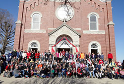 Some 160 pilgrims pose in front of St. Martin Church in Yorkville at the end of a six-mile walking pilgrimage on March 28, the Saturday before Palm Sunday, that visited three of the four campuses of All Saints Parish in Dearborn County. (Submitted photo)