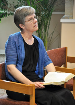 Benedictine Sister Jennifer Mechtild Horner enjoys a moment of quiet prayer at the Sisters of St. Benedict’s Our Lady of Grace Monastery in Beech Grove on June 1, six days before her installation as prioress of the monastery. (Photo by Natalie Hoefer)
