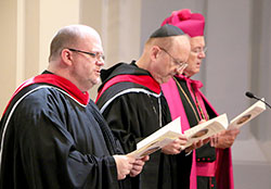 Benedictine Father Brendan Moss, left, Benedictine Abbot Gregory Polan and retired Archbishop Jerome Hanus of Dubuque, Iowa, take part in an Aug. 23 inauguration ceremony at the Basilica of the Immaculate Conception at Conception Abbey in Conception, Mo. Father Brendan, a monk of Saint Meinrad Archabbey in St. Meinrad, was formally installed during the ceremony as president-rector of Conception College Seminary, which is operated by Conception Abbey. Abbot Gregory is the current leader of the monastic community, and Archbishop Hanus previously led it. (Submitted photo)