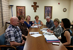 At the Archbishop Edward T. O’Meara Catholic Center in Indianapolis on July 1, the “Being and Belonging” team prepares for the upcoming divorce ministry retreat on Oct. 2-4. Judy Aramount, one of the creators of the retreat, is seated second from left. (Submitted photo) 