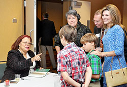 Alveda King, niece of the Rev. Martin Luther King, Jr., left, shares a story with the grandchildren of Cindy Noe, standing at left, before signing a copy of her book at the Right to Life of Indianapolis “Celebrate Life” dinner in Indianapolis on Sept. 29. During the dinner, Noe received Right to Life of Indianapolis’ Respect for Life Award. (Photo by Natalie Hoefer) 
