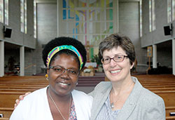 When Cynthia Kanko, left, needed a friend to help her through the challenges of a cancer diagnosis, she unexpectedly found one in a stranger, Georgia Frey. They are pictured inside St. Paul Catholic Center in Bloomington, their home parish. (Photo by John Shaughnessy)