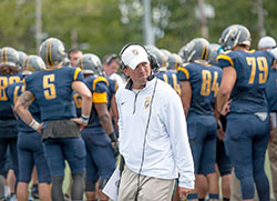 Marian University head football coach Mark Henninger, who led his team to the 2015 championship of the National Association of Intercollegiate Athletics, has a passion for the sport, his family and his Catholic faith. (Submitted photo)