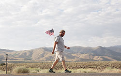David Roth, a 23-year veteran of the Indianapolis Metropolitan Police Department, walked 3,100 miles across America this summer to honor “the fallen, wounded and deployed” men and women who have served in the United States military, and to raise money for a retreat home for military families. Here, he is pictured walking through Nevada in August. (Submitted photo) 
