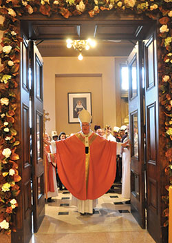 “This is the Lord’s gate: let us enter through it and obtain mercy and forgiveness,” then-Archbishop Joseph W. Tobin declares as he opens the doors of mercy at SS. Peter and Paul Cathedral in Indianapolis on Dec. 13, 2015. The local Holy Doors of Mercy close on Nov. 13. (Criterion file photo by Natalie Hoefer)