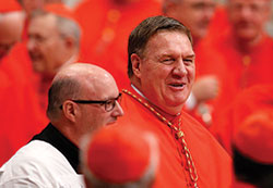 Cardinal-designate Joseph W. Tobin arrives for the consistory in St. Peter’s Basilica at the Vatican on Nov. 19. Also shown is Msgr. William F. Stumpf, archdiocesan moderator of the curia. Cardinal Tobin was among 17 new cardinals created by Pope Francis at the consistory. (CNS photo/Paul Haring) 