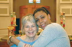 The bond between Anna Brown-Mitchell, left, of St. Monica Parish in Indianapolis and Chanita Dawson has grown strong as Anna has helped Chanita make a new life after Chanita served her time for a non-violent crime. (Photo by John Shaughnessy)