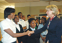 U.S. Secretary of Education Betsy DeVos shakes hands with Alexis Stratton, a freshman at Providence Cristo Rey High School in Indianapolis, during her visit to the school on May 23. (Photo by John Shaughnessy)