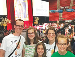 Doug Bauman, left, and his wife, Julie, second from right, are pictured with their daughters Annie, second from left, Betsy and Lily before the Sept. 23 beatification Mass for Father Stanley Rother in the Cox Convention Center in Oklahoma City, Okla. (Submitted photo)