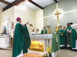 Archbishop Charles Thompson incenses the newly-installed altar of St. Joseph Church in Indianapolis on Oct. 15 following a two-month renovation of the worship space. (Photo by Katie Rutter)