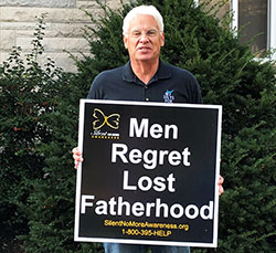 Tom McBroom holds a sign on Oct. 7 during the LifeChain event in Terre Haute, which he organized. (Submitted photo) 