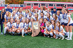Members of the girls’ soccer team from Cathedral High School in Indianapolis poses on Oct. 27 after winning the Class 2A state championship. (Submitted photo)