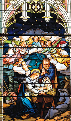 Mary and the Christ Child are depicted in this stained-glass window located in Prince of Peace Church in Madison. The feast of the Nativity of Christ, a holy day of obligation, is celebrated on Dec. 25. (Photo by Laura Jayne Gardner Photography)