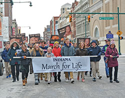Students of Lumen Christi Catholic School in Indianapolis carry a banner as they process up Meridian Street leading the second annual Indiana March for Life in Indianapolis on Jan. 22, 2019. (File photo by Natalie Hoefer)