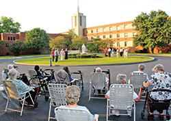 More than 20 Sisters of St. Benedict hold a prayer vigil outside Our Lady of Grace Monastery in Beech Grove on Aug. 25, prior to two federal executions that took place on Aug. 26 and 28 in Terre Haute. (Submitted photo)
