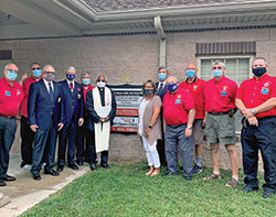 Members of Knights of Columbus Council 7431 in Mooresville join Father Francis Kalapurackal and Monica Kelsey on Sept. 1 outside a fire station in Mooresville for the dedication of a new Safe Haven baby box. Father Kalapurackal is pastor of St. Thomas More Parish in Mooresville. Kelsey is the founder of Safe Haven Baby Boxes. (Submitted photo)