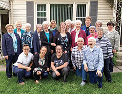 Providence Sister Arrianne Whittaker, center, second row, celebrates with fellow members of her religious community after graduating in 2019 from medical school at Marian University in Indianapolis. (Submitted photo)