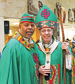 Divine Word Father Charles Smith and Archbishop Charles C. Thompson smile after celebrating the closing Mass for the National Black Catholic Men’s Conference at St. Rita Church in Indianapolis on Oct. 15. The gathering was renamed in honor of Father Charles’ late twin brother, Divine Word Father Chester Smith, who co-founded the conference in 2004. (Submitted photo by Frances Guynn)
