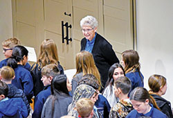 Mercy Sister Paulanne Diebold interacts with sixth-graders of New Albany Deanery Catholic schools during a religious and ordained ministry vocations fair hosted by the New Albany Knights of Columbus on Feb. 2. (Photo by Natalie Hoefer)