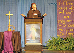 Sister Mary Augustine McMenamy, a member of the Sisters of Reparation to the Most Sacred Heart of Jesus in Steubenville, Ohio, speaks at the Indiana Catholic Women’s Conference on March 11 at the Indiana Convention Center in Indianapolis. (Photo by Jennifer Lindberg)