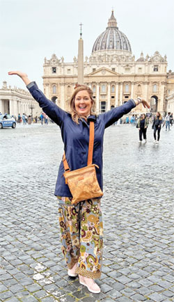 Kerin O’Rourke Buntin beams and outstretches her body toward the heavens during a visit to St. Peter’s Square at the Vatican on May 20, a time when she felt wrapped in God’s presence. (Submitted photo)