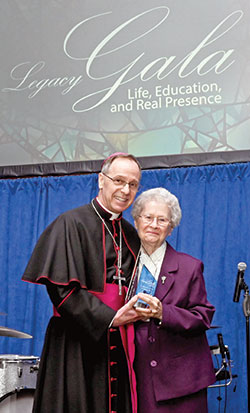 Archbishop Charles C. Thompson poses with Franciscan Sister Shirley Gerth after she received the archdiocese’s Legacy Award at the Legacy Gala at the JW Marriott in Indianapolis on Feb. 9. (Photo by Rob Banayote)