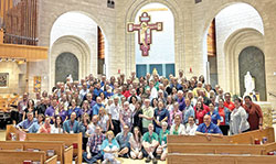 Teams of Our Lady “Sector couples”—couples who coordinate smaller teams within a geographical area in the U.S.—pose for a photo in Our Lady of Loretto Church in Foxfield, Colo., during a training weekend in July of 2023. (Submitted photo)