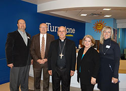 Bishop Kevin C. Rhoades toured Turnstone, a unique non-profit organization that serves individuals with physical and other disabilities, in Fort Wayne on Jan. 7. Shown from left are Dave Springmann, Turnstone Chief Financial Officer; Mike Mushett, Turnstone CEO; Bishop Rhoades; Meg Distler, CEO of St. Joe Community Health Foundation; and Ruth Stone, Turnstone Chief Development Officer.