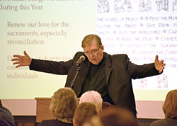 Father Martin Dobrzynski, pastor of St. Michael the Archangel Church, gives a presentation about the basis for and benefits of The Year of Mercy at the Schererville church on Jan. 21. (Anthony D. Alonzo photo)