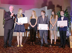 Master of Ceremonies Mike Blake, left, salutes 2016 MEO Tri-State IDOL winner Stasia Reisinger, standing next to him, the trio of Jessica Weinzapfel, Matt Cassidy and Emily Pfister, who finished third, and second-place finisher Colton Colbert.