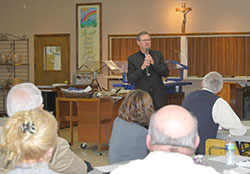 Bishop Timothy L. Doherty speaks at St. Ann Parish, Lafayette, on April 10.
