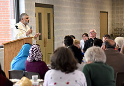 Shayk Mongy El-Quesny of the Northwest Indiana Islamic Center speaks to those gathered at the Catholic-Muslim dialogue event hosted at St. Mary Church's Hammes Hall in Crown Point on Apri 24. The bridge-building meeting was sponsored by the office of Ecumenism & Interreligious Affairs at Calumet College of St. Joseph and the NWIIC. (Anthony D. Alonzo photo)