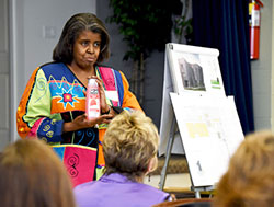 Sherita Brewer, Sojourner Truth House development services manager, tells prospective local donors that a bottle of soap or shampoo can be a God-send for a homeless person, during the Coffee & Conversation session at the ministry for at-risk women in Gary on April 21. (Anthony D. Alonzo photo)