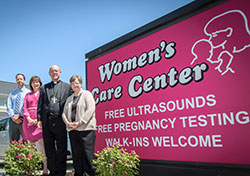 Bishop Kevin C. Rhoades blessed the newest Women’s Care Center located at 4600 West Jefferson Blvd., in Fort Wayne on Tuesday, June 6. With him are Bobby Williams, Ann Manion, board president and Ann Koehl, director.
