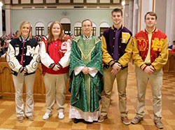 Bishop Charles C. Thompson visits with with seniors from the diocese of Evansville's four Catholic high schools before the Feb. 1 Catholic Schools Week Mass at St. Benedict Cathedral. The Message photos by Tim Lilley.