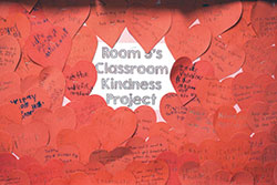 Red hearts record acts of kindness done by first-graders in teacher Perry Langley’s class at St. Mary Cathedral School in Lafayette. (Photo by Caroline B. Mooney)