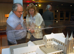 Parishioners Felix and Laurel Gorney look over the models unveiled for St. John Vianney Parish in Fishers on April 19. “You couldn’t ask for more in a church,” Felix Gorney said of the plans. (Photo by Caroline B. Mooney)