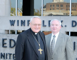 Bishop Gerald A. Gettelfinger and the executive director of the Indiana Catholic Conference, Glenn Tebbe, stop outside the federal building in Evansville Sept. 8 after meeting with Rep. Brad Ellsworth, D-Ind. (Message photo by Paul R. Leingang)