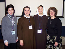 Speaking on married and virginal motherhood at the Edith Stein conference were Lisa Everett, far right, and Sister M. Benedicta, OSF, second from right. Elizabeth Kirk, far left, chaired the session, and Sister Margaret Mary Mitchel, OSF, second from left, assisted with Sister Benedicta’s PowerPoint presentation.