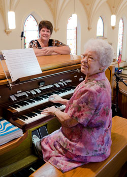Rosina Harber, at the St. Patrick, Arcola, organ is shown with her daughter Annette Lamle. A reception for parishioners, friends and family is being planned in the parish hall after her 7:30 a.m. retirement Mass on Sunday, Aug. 28.