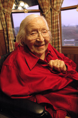 St. Charles Borromeo parishioner Emelie Weil of Milan celebrated her 110th birthday on Nov. 20, 2009. During 11 decades, she has acquired skills in nursing, playing the piano, painting, tatting and basket weaving. When she was complimented on a beautiful handmade basket on Jan. 17, Emelie smiled and replied, “Flatter me like that and it will go to my head.” (Photo by Mary Ann Wyand)