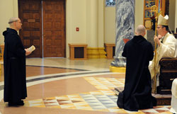 Benedictine Brother Francis de Sales Wagner, left, stands before Benedictine Archabbot Justin Duvall during a Jan. 25 liturgy in which he professed solemn vows as a monk of Saint Meinrad Archabbey in St. Meinrad. The liturgy took place in the monastic community’s Archabbey Church of Our Lady of Einsiedeln. (Photo courtesy Saint Meinrad Archabbey)