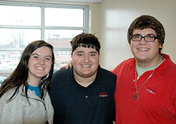 The smiles show the friendship of Allison Kelly, Charlie Springman and David Saling, a friendship that developed from their involvement in a rare Catholic high school program at Roncalli High School in Indianapolis. (Photo by John Shaughnessy)