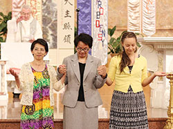 Providence Sisters Anna Fan, left, Dina Bato and Tracey Horan hold hands during a ceremony in which they professed vows in the Church of the Immaculate Conception at Saint Mary-of-the-Woods on June 25. Sisters Anna and Tracey professed first vows with the Sisters of Providence, while Sister Dina professed final vows. (Submitted photo)