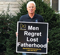 Tom McBroom holds a sign on Oct. 7 during the LifeChain event in Terre Haute, which he organized. (Submitted photo) 